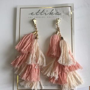 Peach and cream colored dangle earrings